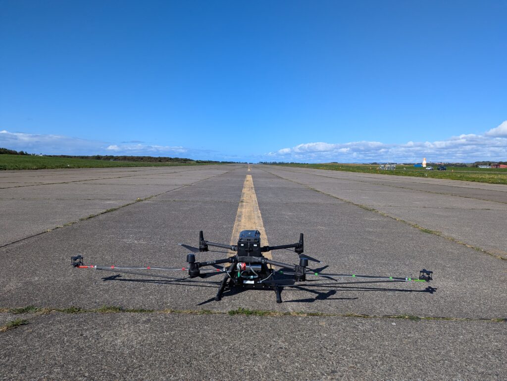 Explicit drone fitted with wind sensors on a runway